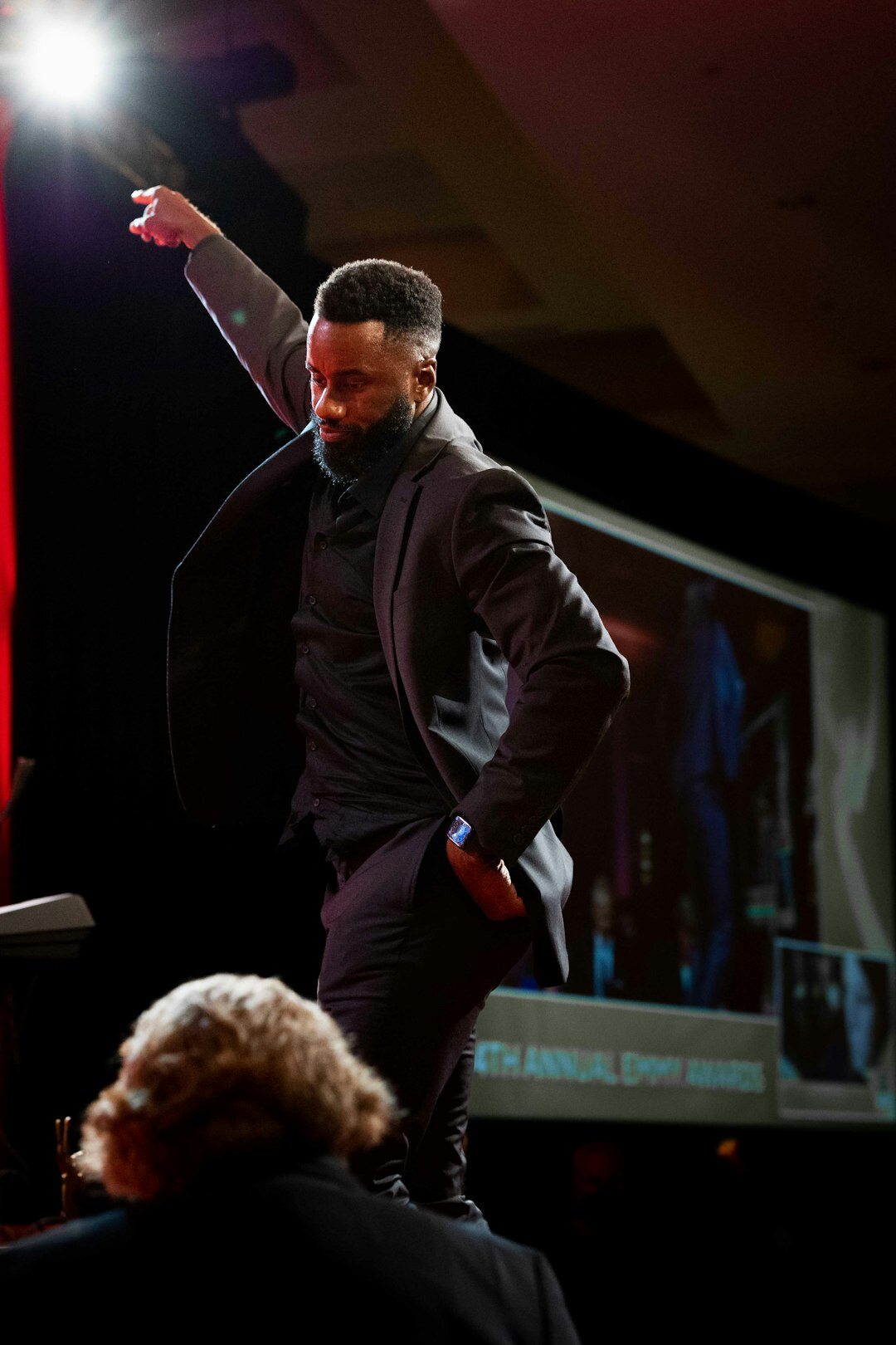 Business leader speaking at a conference podium